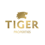 Luxury modern house exterior with lush green lawn in a premium neighborhood.